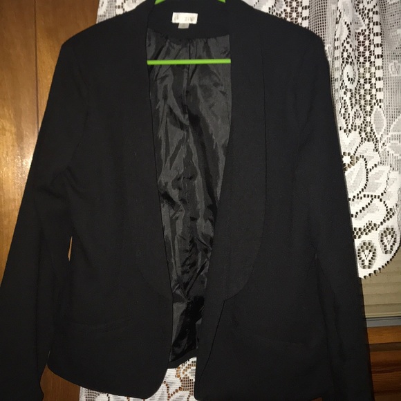 A black dress up jacket. - Picture 1 of 3